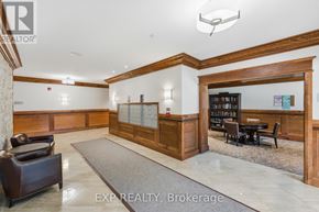 Carleton Place condo for rent - A well-lit office lobby with a reception desk and a bookshelf.