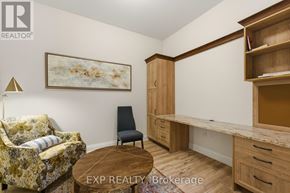 Carleton Place condo for rent - A room with a couch, chair, and desk with EXP Realty Brokerage in the corner.