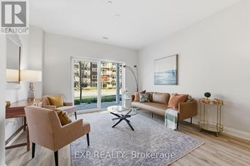 Carleton Place condo for rent - A well-lit living room with a dining table and chairs.
