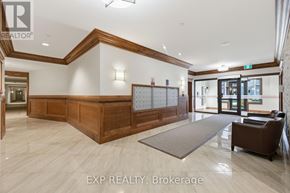 Carleton Place condo for rent - A reception area with a wooden reception desk and a brown armchair.