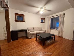 Toronto (East End-Danforth) apartment for rent - A living room with a couch, chair, and coffee table.