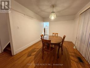 Toronto (East End-Danforth) apartment for rent - A dining room with a wooden table and chairs.