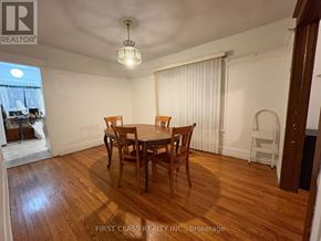 Toronto (East End-Danforth) apartment for rent - A dining room with a wooden table and chairs.