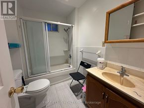 Toronto (East End-Danforth) apartment for rent - A bathroom with a toilet, sink, and bathtub.