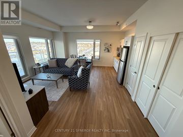 Ottawa apartment for rent - A living room with a couch and a chair.