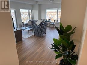 Ottawa apartment for rent - A living room with a couch and a television.