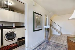 Toronto (Humber Heights) townhouse for rent - A laundry room with a washer and dryer in it.