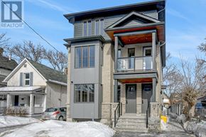 Ottawa multi-family for rent - A two-story house with a grey and brown exterior is for sale.