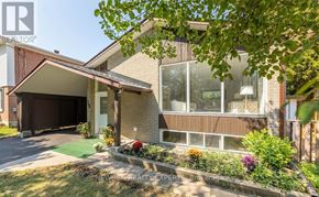 Toronto (West Hill) apartment for rent - A house with a brown garage door and a white door.