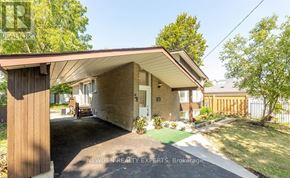 Toronto (West Hill) apartment for rent - A house with a brown roof and a white door is surrounded by greenery.
