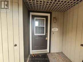 Collingwood condo for rent - A door with a glass window and a sign above it.