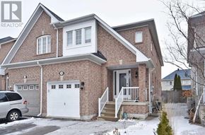 Vaughan (Vellore Village) apartment for rent - A house with a white garage door is for sale.