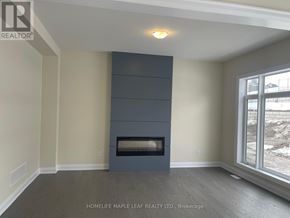 Oro-Medonte apartment for rent - A room with a fireplace and a window showing a snowy landscape.