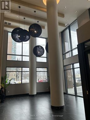 Toronto (Bendale) condo for rent - A large room with a lot of windows and a plant in the corner.