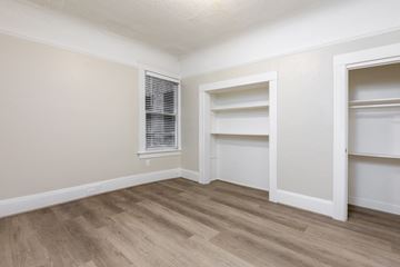 San Francisco apartment for rent - A room with a window and two shelves.