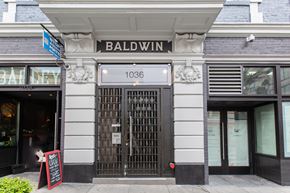 San Francisco apartment for rent - The front of a building with a black door and a sign that says Baldwin.