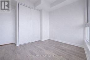 Vaughan (Vaughan Corporate Centre) condo for rent - A room with a wood floor and white walls.