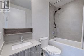 Vaughan (Vaughan Corporate Centre) condo for rent - A white bathroom with a toilet, sink, and bathtub.