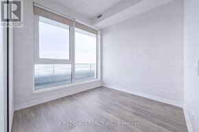 Vaughan (Vaughan Corporate Centre) condo for rent - A room with a large window and wooden flooring.