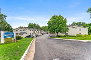 Atlanta apartment for rent - a street with houses and cars parked on the side
