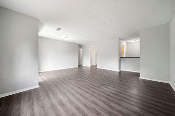 Atlanta apartment for rent - an empty living room with white walls and wood floors