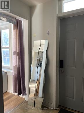 Kingston (Central City East) apartment for rent - A white ladder is leaning against a wall next to a door.