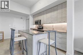 Waterloo condo for rent - A modern kitchen with a bar stool.