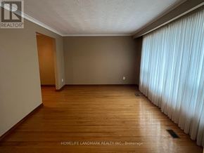Markham (Unionville) apartment for rent - A room with wooden flooring and a window with white curtains.