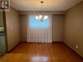 Markham (Unionville) apartment for rent - A room with wooden floors and a chandelier.