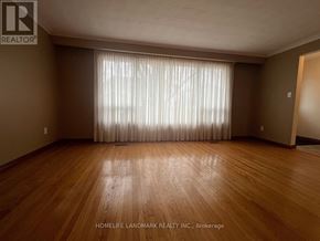 Markham (Unionville) apartment for rent - A room with wooden flooring and a large window with curtains.