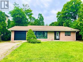 Vaughan (Maple) apartment for rent - A house with a green lawn in front of it.