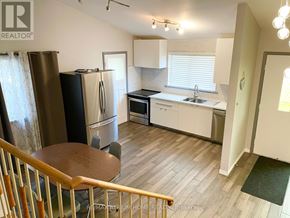 Vaughan (Maple) apartment for rent - A kitchen with a refrigerator, sink, and stove.