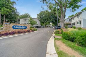 Atlanta apartment for rent - a street with a sign in front of some houses