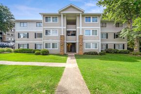Atlanta apartment for rent - a walkway in front of an apartment building with grass