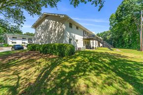 Clarkston apartment for rent - a white house with a lawn in front of it