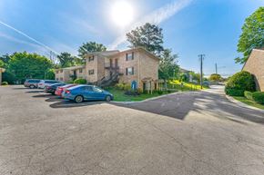 Decatur apartment for rent - a row of cars parked in front of a brick building
