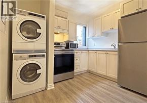 Hamilton apartment for rent - A clean, modern kitchen with a washer and dryer built in.