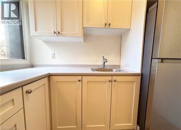 Hamilton apartment for rent - A kitchen with a sink and cabinets.