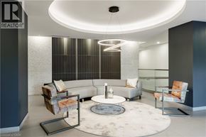 Burlington condo for rent - A modern living room with a grey and white color scheme.