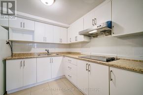 Toronto (Agincourt South-Malvern West) apartment for rent - A kitchen with white cabinets and a granite countertop.