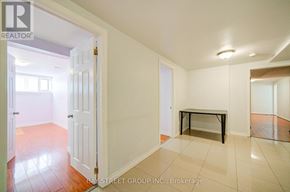 Toronto (Agincourt South-Malvern West) apartment for rent - A white door opens to a room with a bench and tiled flooring.
