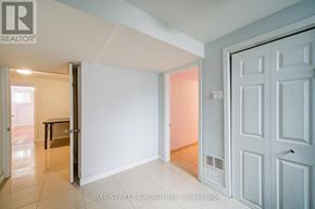Toronto (Agincourt South-Malvern West) apartment for rent - A white door is open to a room with a tiled floor.