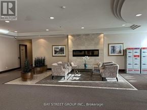 Richmond Hill (Langstaff) condo for rent - A waiting area with chairs and a coffee table.