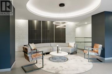 Burlington (Lasalle) condo for rent - A modern living room with a circular coffee table in the center.