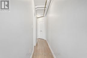 Hamilton (Gibson) apartment for rent - A long hallway with a door at the end.