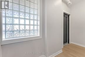 Hamilton (Gibson) apartment for rent - A room with a window and a door.
