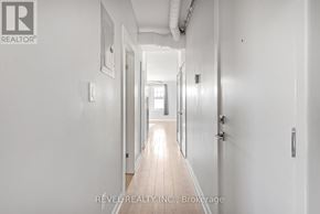 Hamilton (Gibson) apartment for rent - A long hallway with doors on both sides and a light at the end.