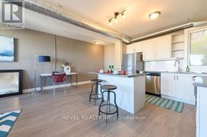 Hamilton (Stipley) apartment for rent - A kitchen with white cabinets and a wooden floor.