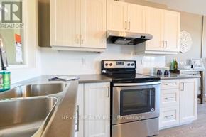Hamilton (Stipley) apartment for rent - A kitchen with a stove, oven, and sink.
