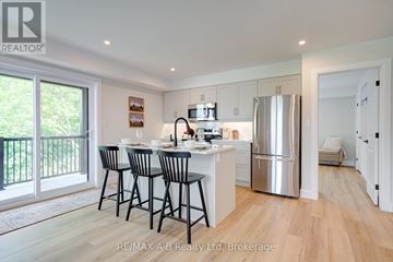 St. Marys townhouse for rent - A modern kitchen with a dining table and chairs.